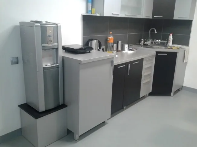 Water dispenser installed in an office kitchenette